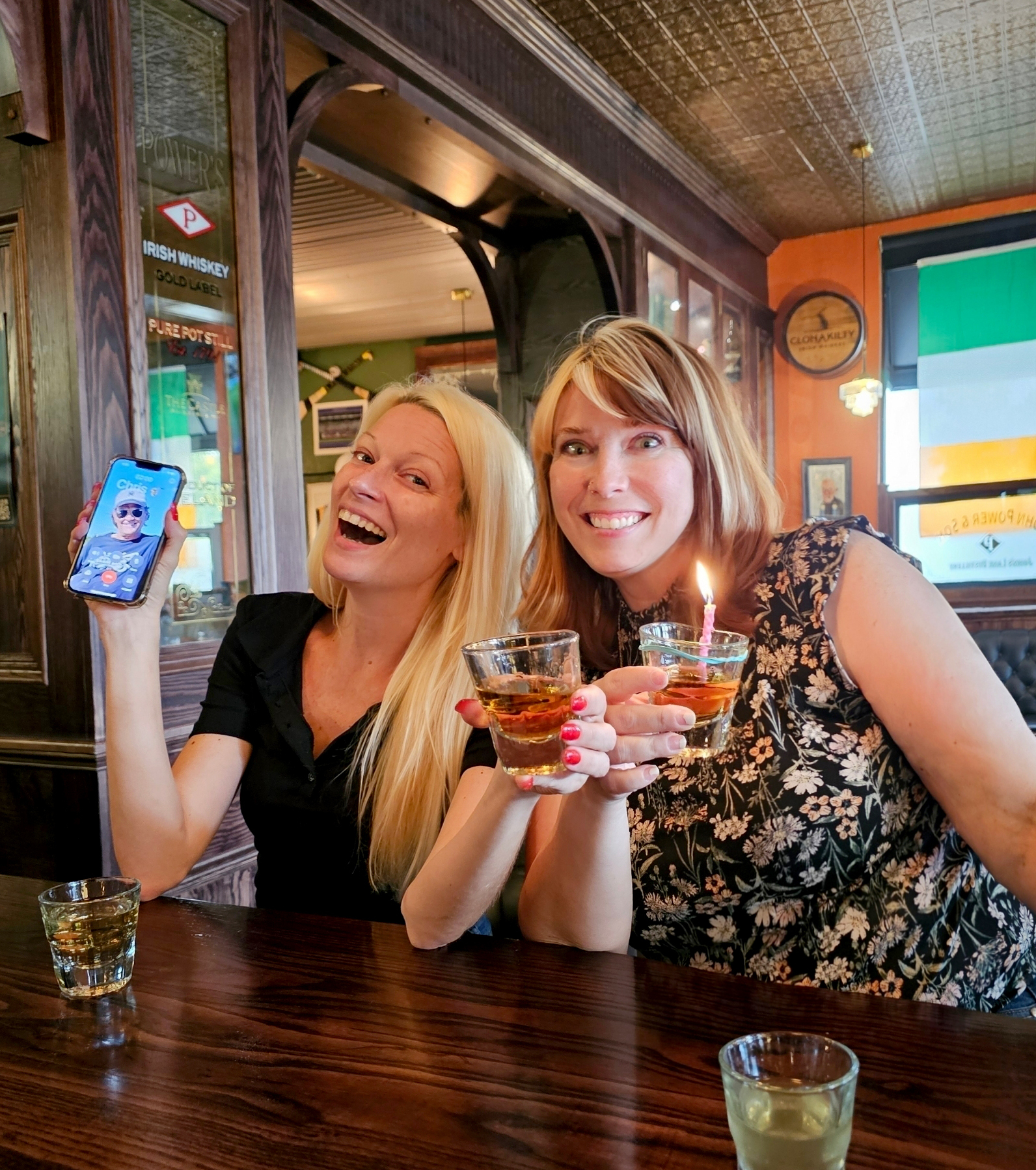 Sarah celebrates her birthday with whiskey and a birthday candle